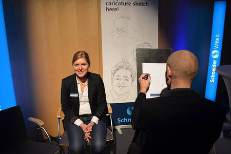 Caricaturist David Müller scetching the guests of the One Event