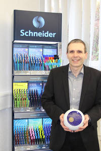 CEO Frank Gross holding the Award "Brand of the Century" in his hands